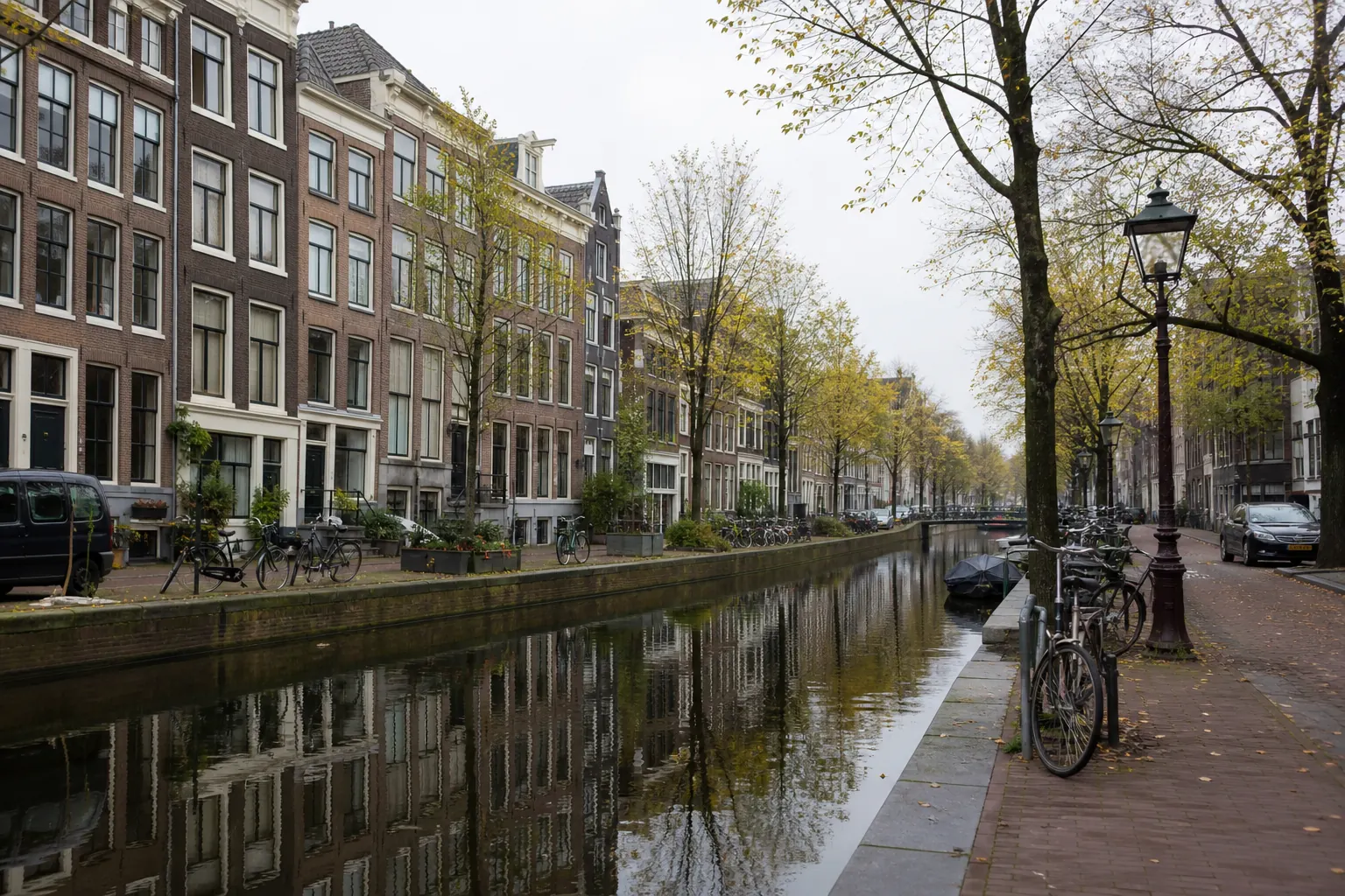A quiet Amsterdam canal on an overcast morning